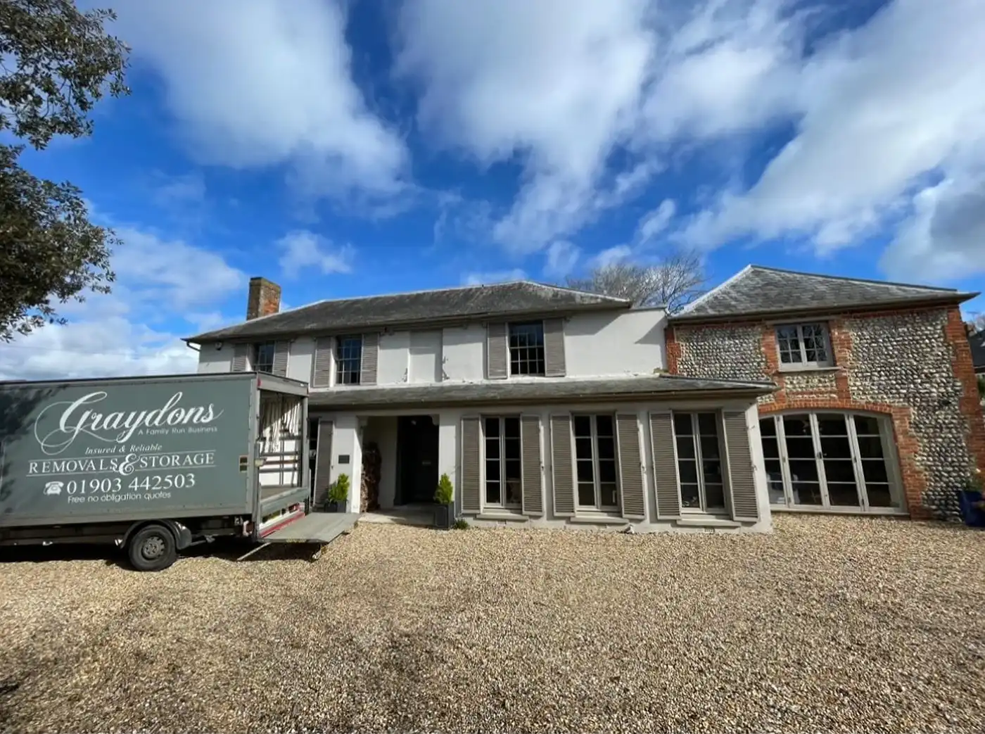 Large house waiting for removal van.